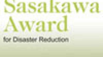 Text reads: "Sasakawa Award for Disaster Reduction" in green and gray font on a light background.