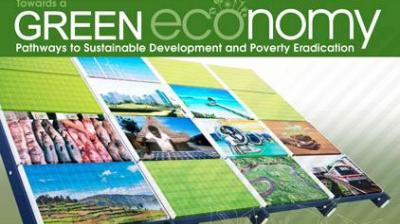 A display board features images of nature, urban development, agriculture, and renewable energy under the title "Towards a GREEN economy: Pathways to Sustainable Development and Poverty Eradication.
