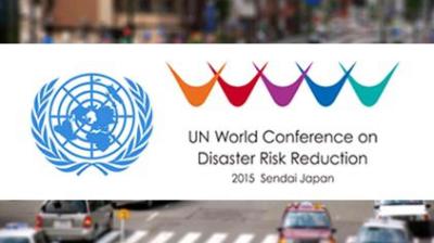 Logo and text for the UN World Conference on Disaster Risk Reduction 2015 in Sendai, Japan, with colorful symbols and the UN emblem.