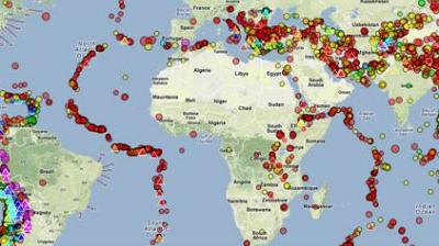 A world map showing earthquake activity with colored dots indicating epicenters and magnitude levels across different regions.