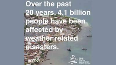 Aerial view of a coastal town with text stating that 4.1 billion people have been affected by weather-related disasters over the past 20 years.