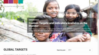 Three children smile at the camera outdoors, with text overlay announcing the availability of custom targets and indicators on the UNISDR Sendai Framework Monitor.