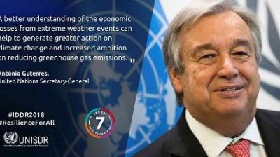 António Guterres, UN Secretary-General, stands in front of a UN logo with a quote about climate change and reducing greenhouse gas emissions. UNISDR and campaign logos are visible.