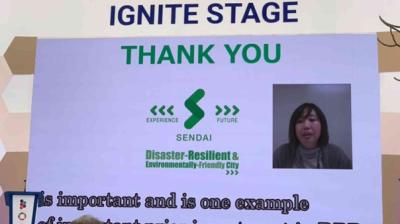 A presentation slide for Sendai as a disaster-resilient, environmentally friendly city reads "THANK YOU" and features a video call speaker and logos on the Ignite Stage.