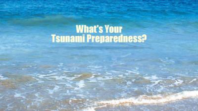 Text "What's Your Tsunami Preparedness?" overlaid on an image of ocean waves approaching a sandy beach.