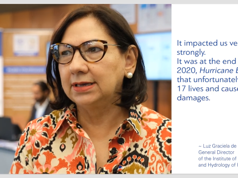 A person with glasses and a colorful blouse stands indoors. A quote about Hurricane Eta's impact, attributed to Luz Graciela de Calzadilla, is displayed on the right side of the image.